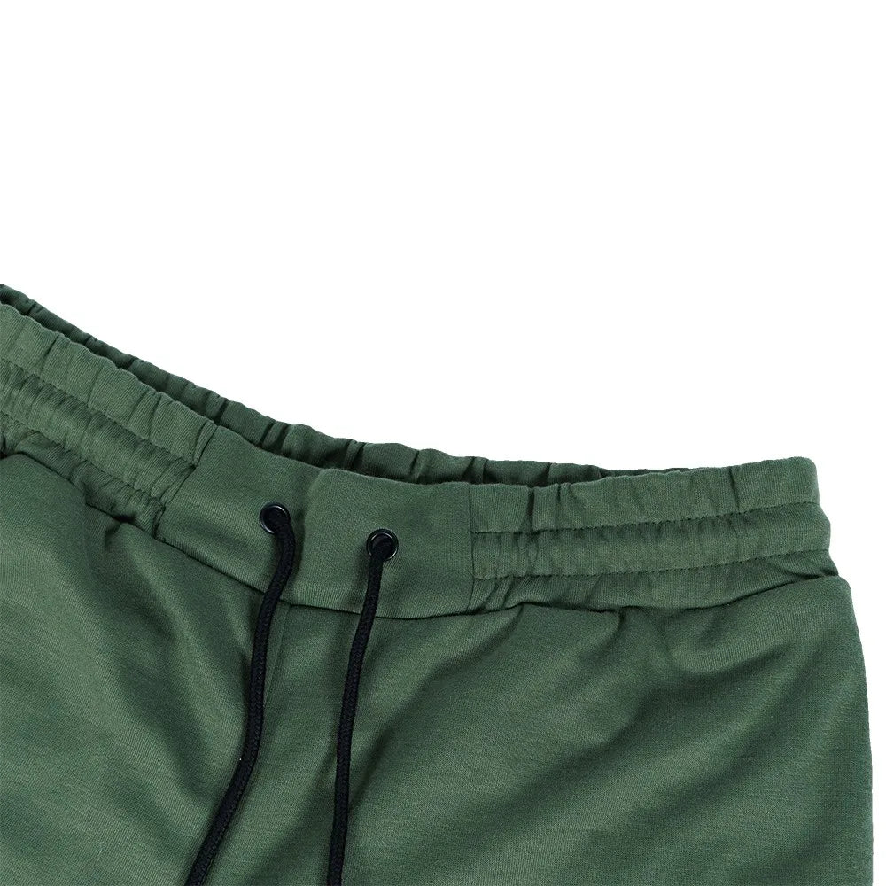Close-up of men's fleece-lined slim fit joggers in olive green with drawstring waistband.