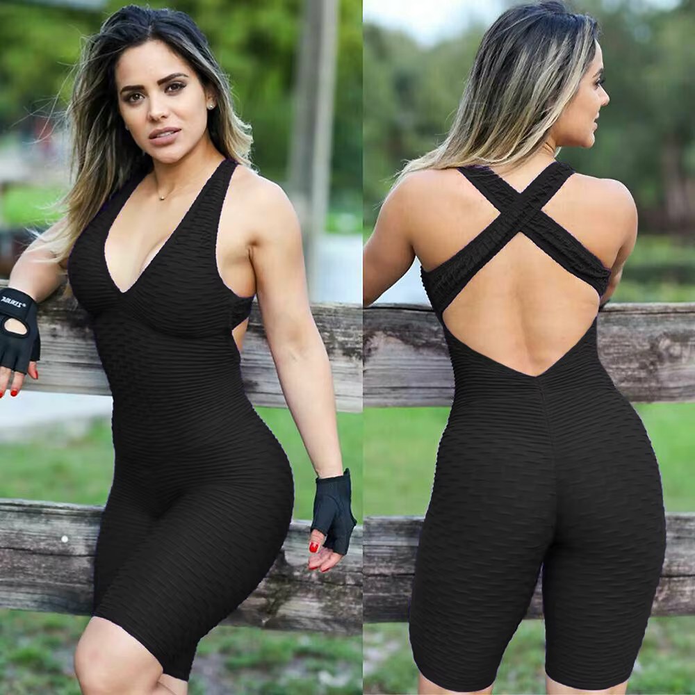 Women's sleeveless backcross bodysuit in black, showcasing stylish design for workouts.