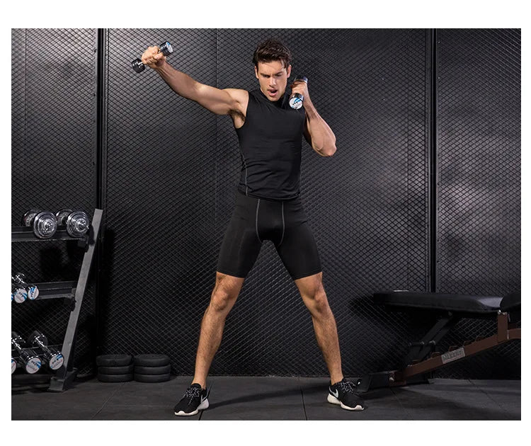 Man wearing a Men’s Quick-Dry Sleeveless Fitness Vest lifting dumbbells in a gym setting.