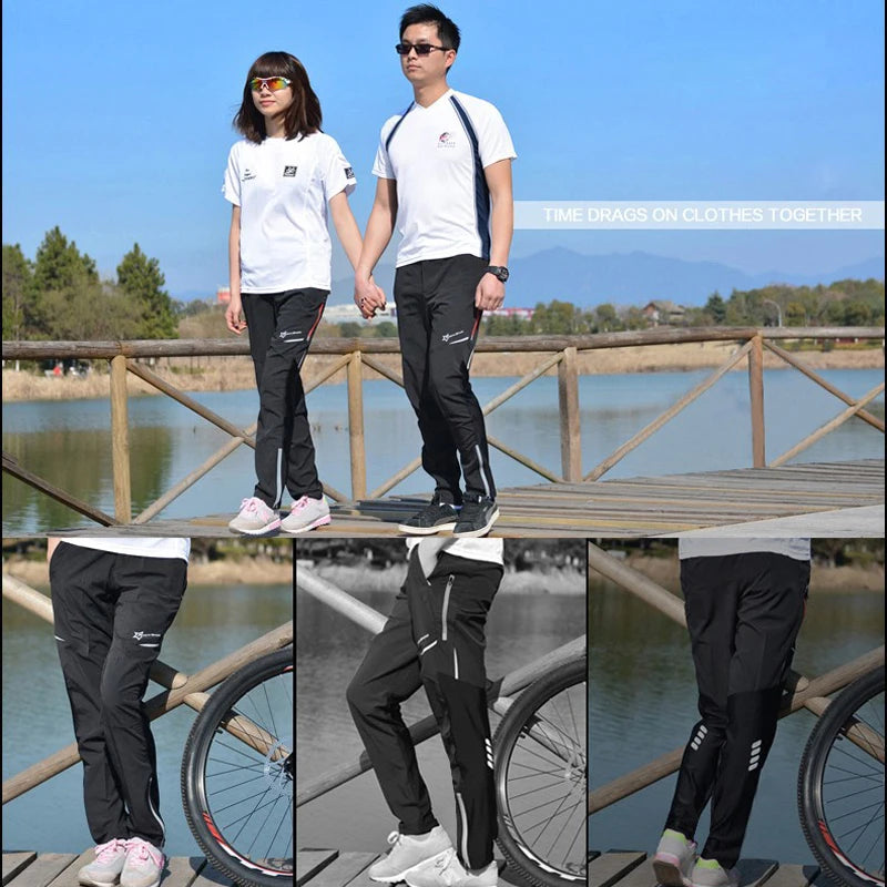 Couple wearing sporty outfits, enjoying a stroll by a lake in stylish black and white clothing.
