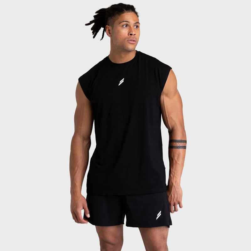 Model wearing a black sleeveless fitness tank top, showcasing a comfortable and stylish look for workouts.