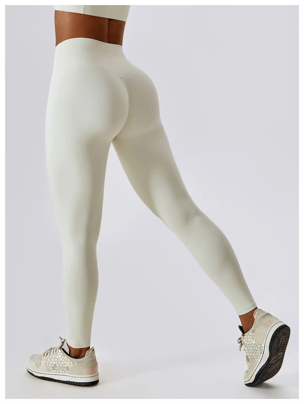 High-waist scrunch butt yoga leggings for women in white, showcasing a curve-enhancing fit and 4-way stretch.
