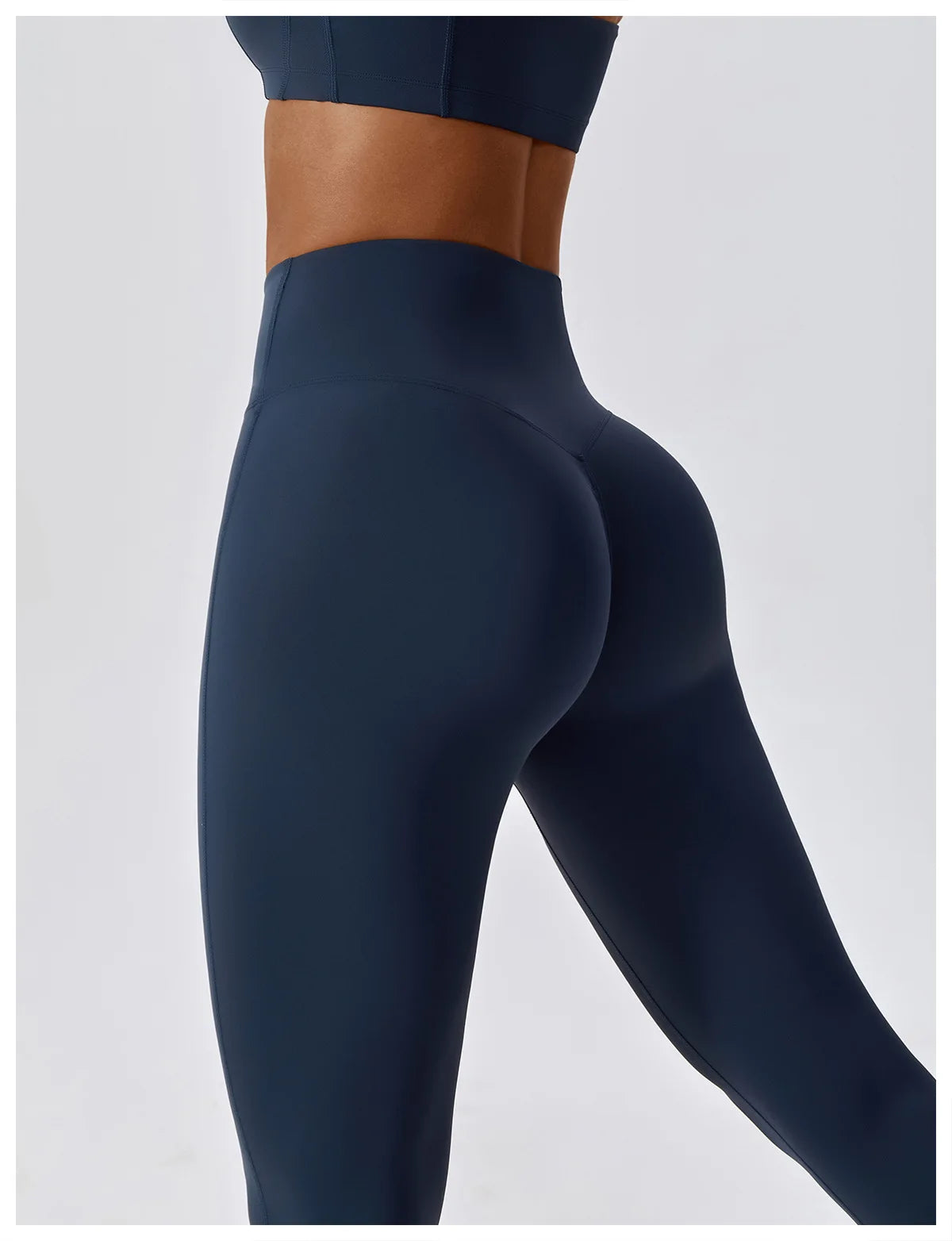 High-waist scrunch butt yoga leggings for women in navy, showcasing a curve-enhancing design and secure fit.