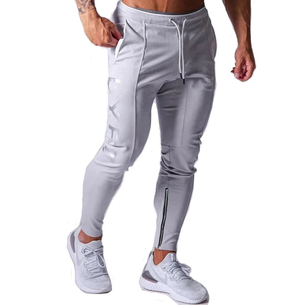 Men's performance training pants in gray, designed for comfort and flexibility during workouts.