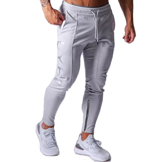 Men's performance training pants in gray, designed for comfort and flexibility during workouts.