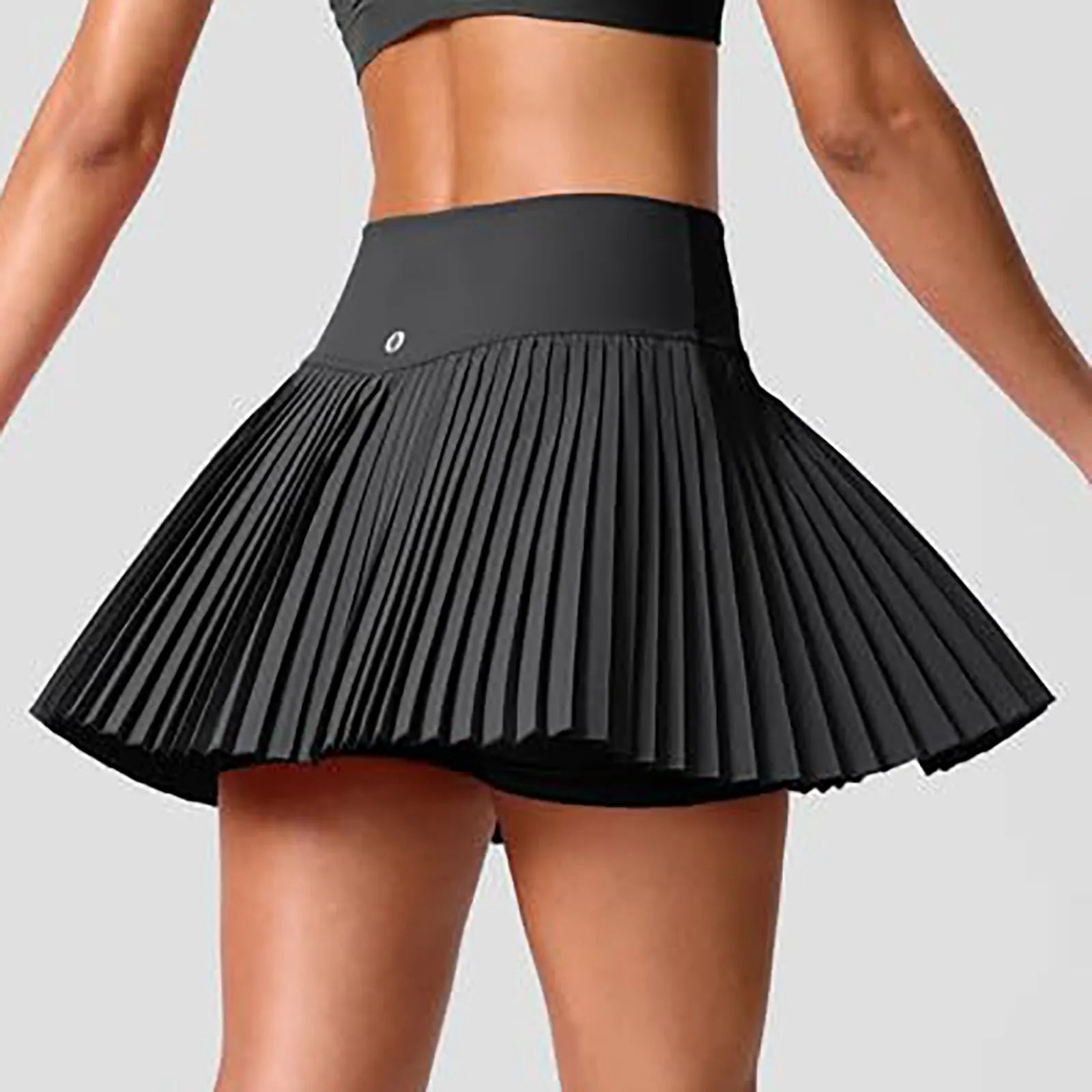 Women's high-waist pleated tennis skirt in black, designed for comfort and performance on and off the court.