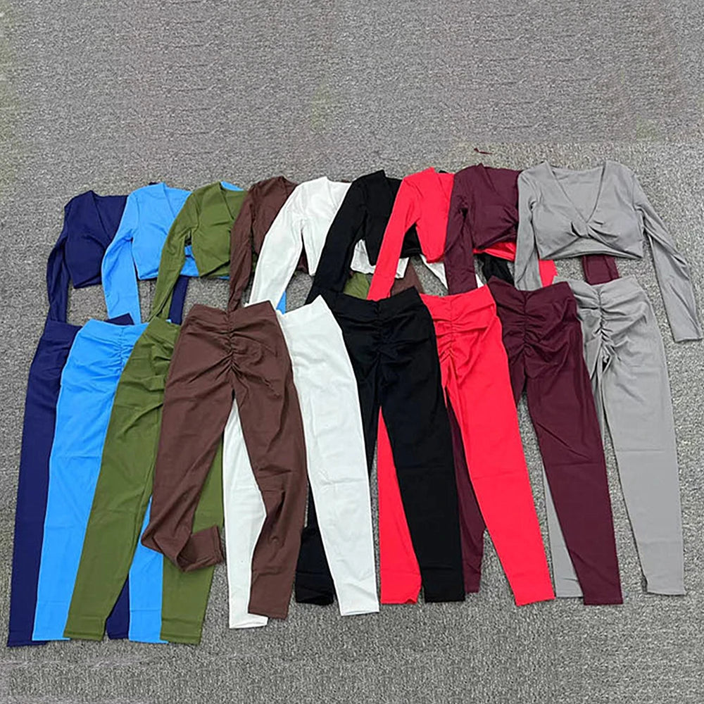 Variety of 2025 women's padded short sleeve crop yoga tops and pants in multiple colors for workouts.
