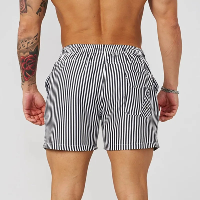 Men's casual sports outdoor shorts in black and white stripes, showcasing elastic waistband and back pocket.