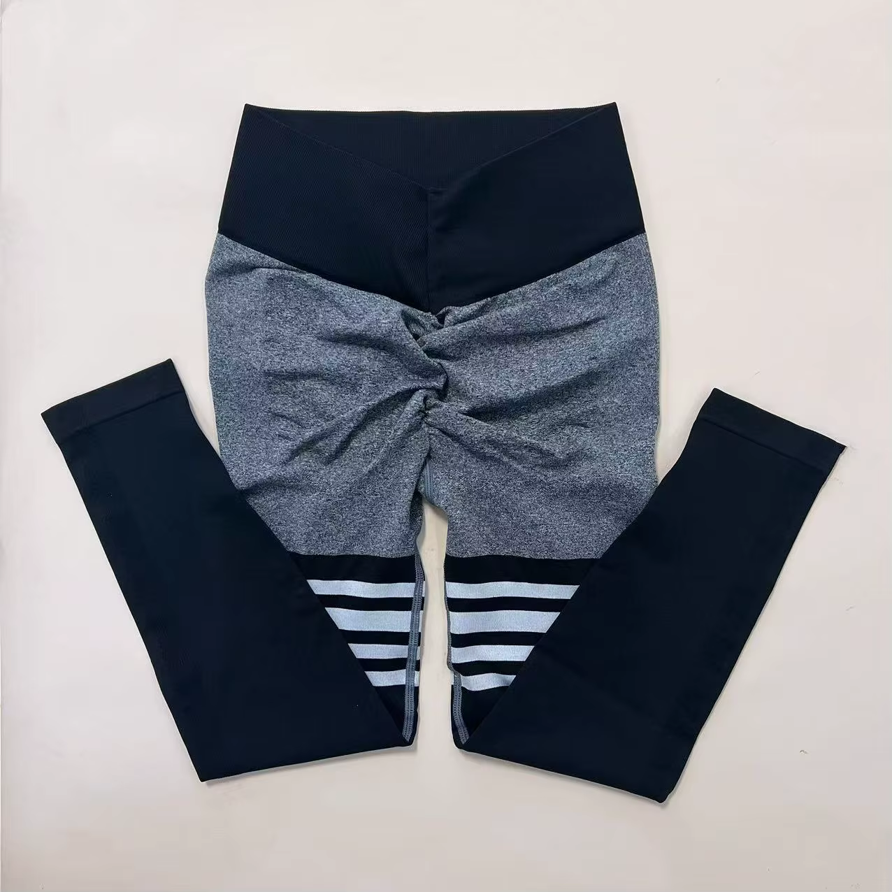 Women’s striped high-waist compression leggings, stylish and functional for workouts and active days.