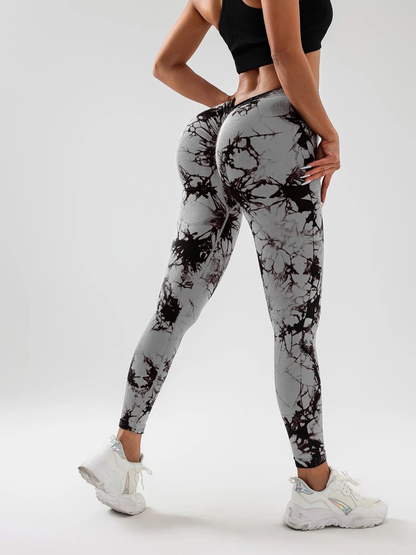 High-waisted tie-dye scrunch butt yoga leggings, showing a flattering fit and stylish design from the back.