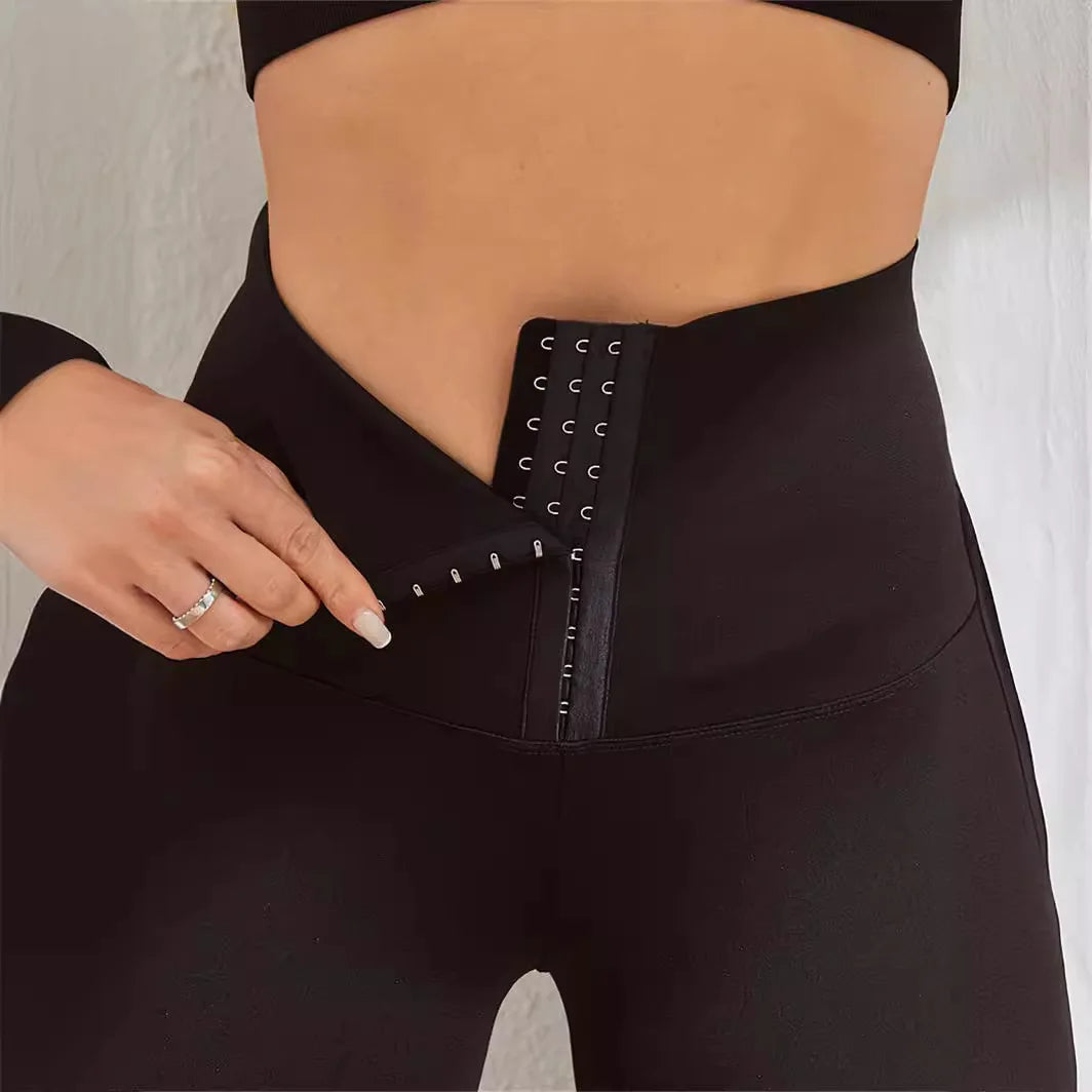 Close-up of high waist tummy control leggings with zipper and hook detail, perfect for shaping and support during workouts.