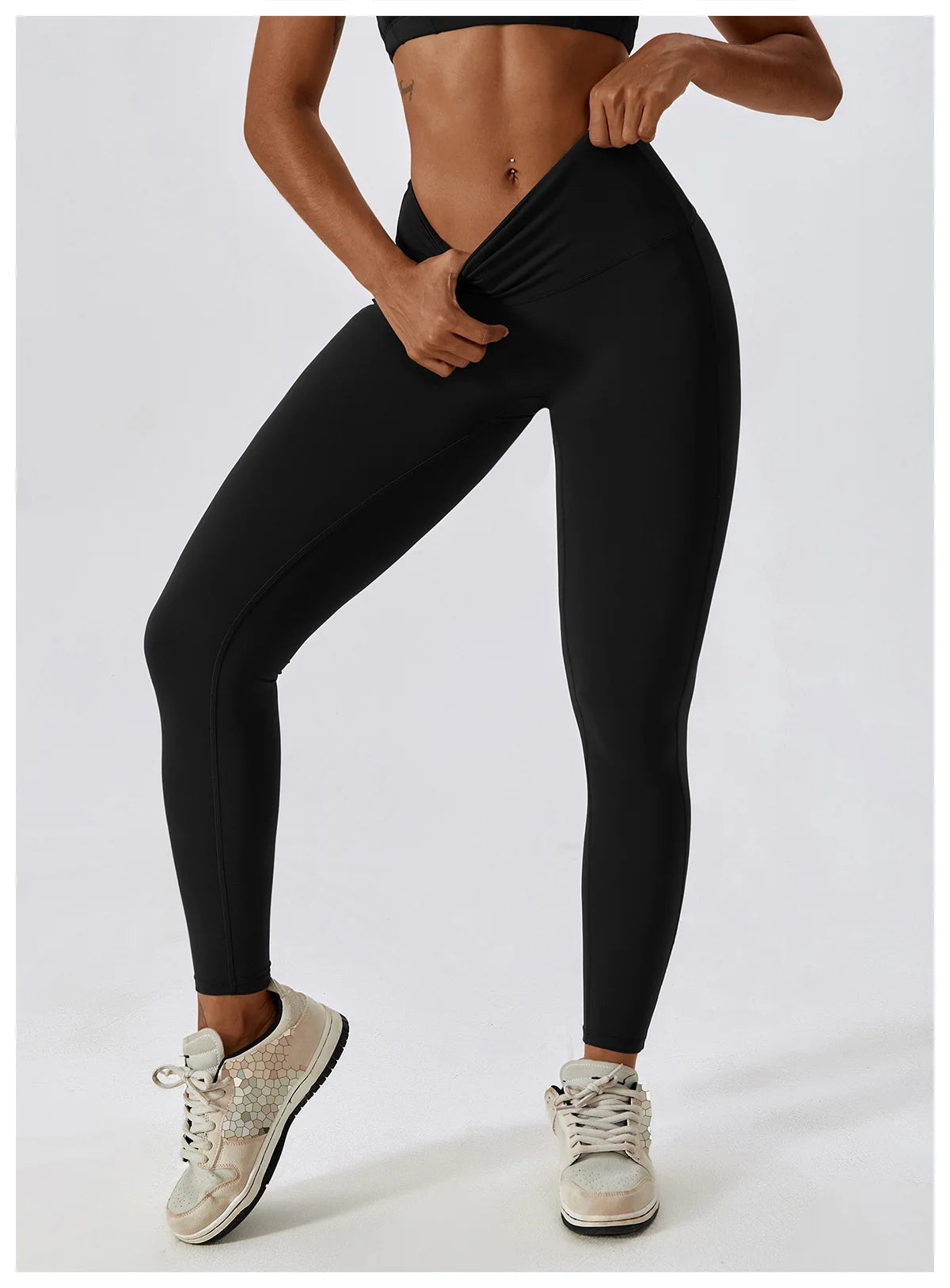 High-waist black yoga leggings for women, showcasing a fitted style and elastic waistband for comfort and support.