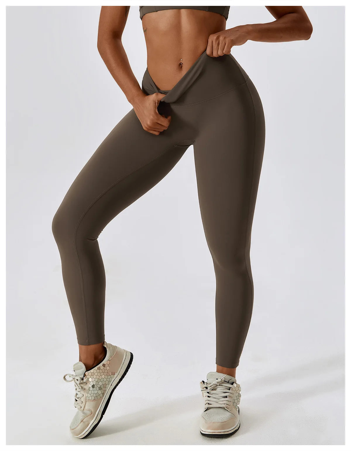 Woman in high-waist scrunch butt yoga leggings showcasing comfort and style during workout.