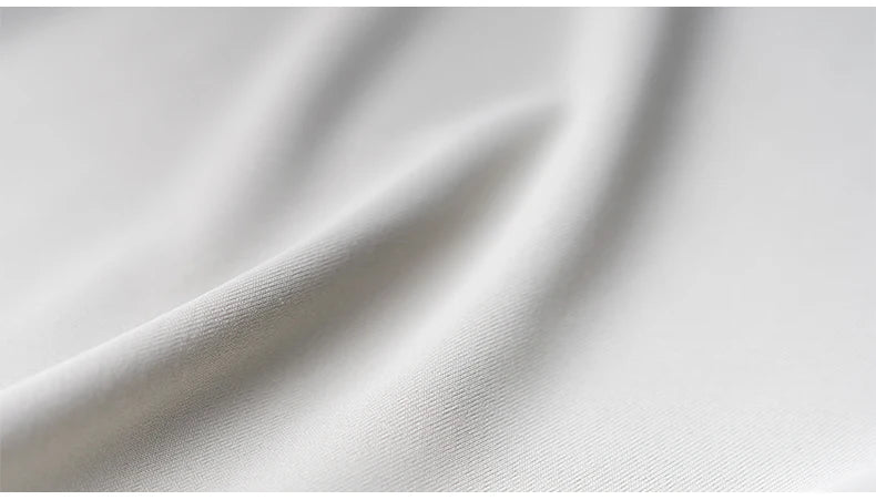 Close-up of smooth, breathable fabric showcasing its texture ideal for athletic apparel.