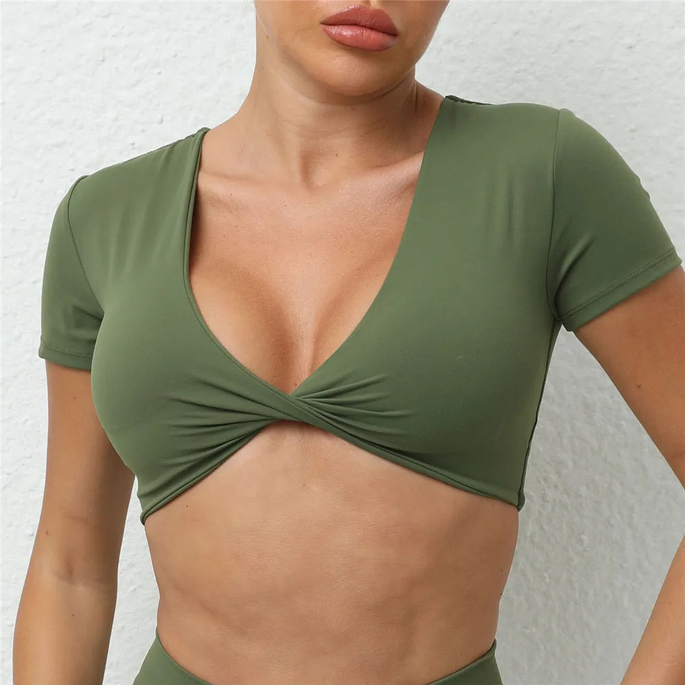 2025 Women's padded short sleeve crop yoga top in olive green, designed for comfort and movement during workouts.