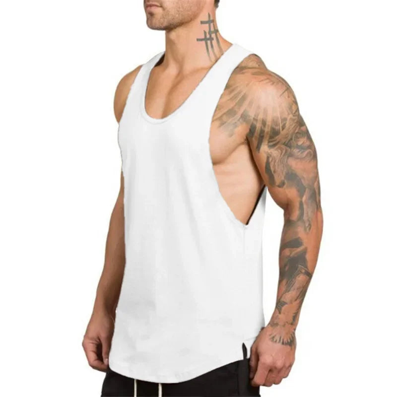 Man wearing a white sleeveless cotton t-shirt, showcasing breathable fabric and a stylish design for workouts.