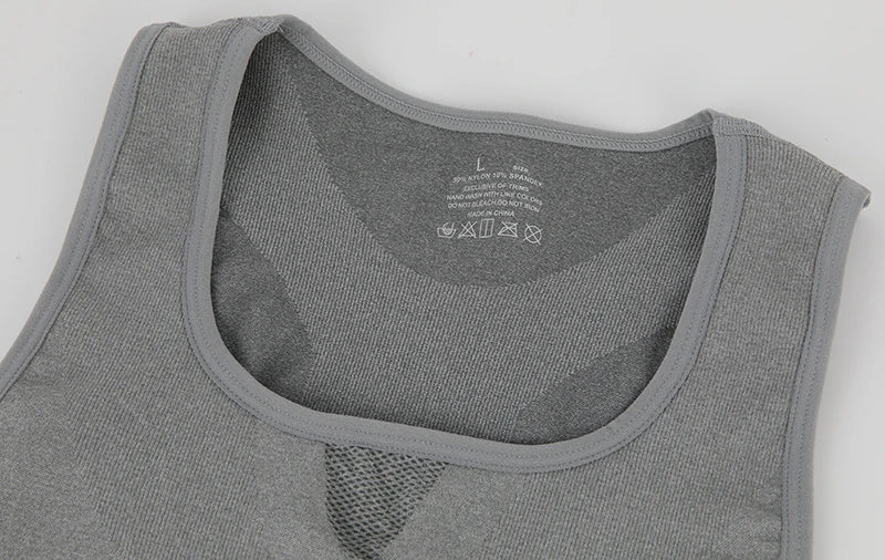 Close-up of the neckline of a Men's Compression Tank Top in gray, showcasing its breathable fabric and size label.