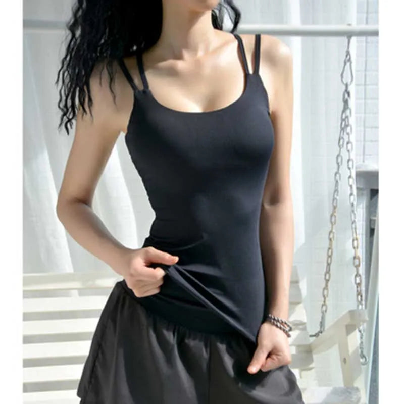 Woman in a slim fit, black workout tank top with adjustable straps, perfect for yoga and gym training.