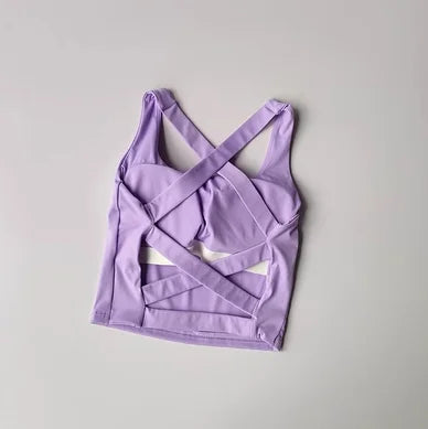 Seamless push-up sports bra for women in lavender color with stylish crisscross back design.