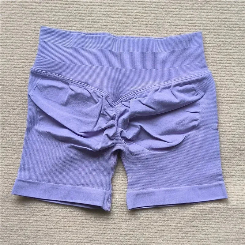 Light purple Gym Impact Running Shorts featuring a high waistband and unique rear design for enhanced comfort and style.