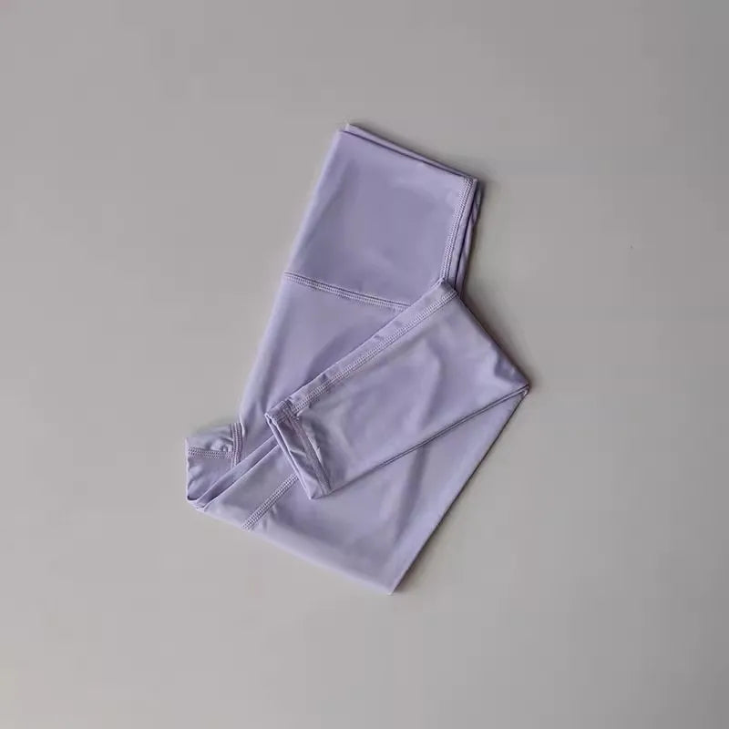 Light purple high-waisted leggings from a women's yoga set, showcasing breathable and flexible fabric.