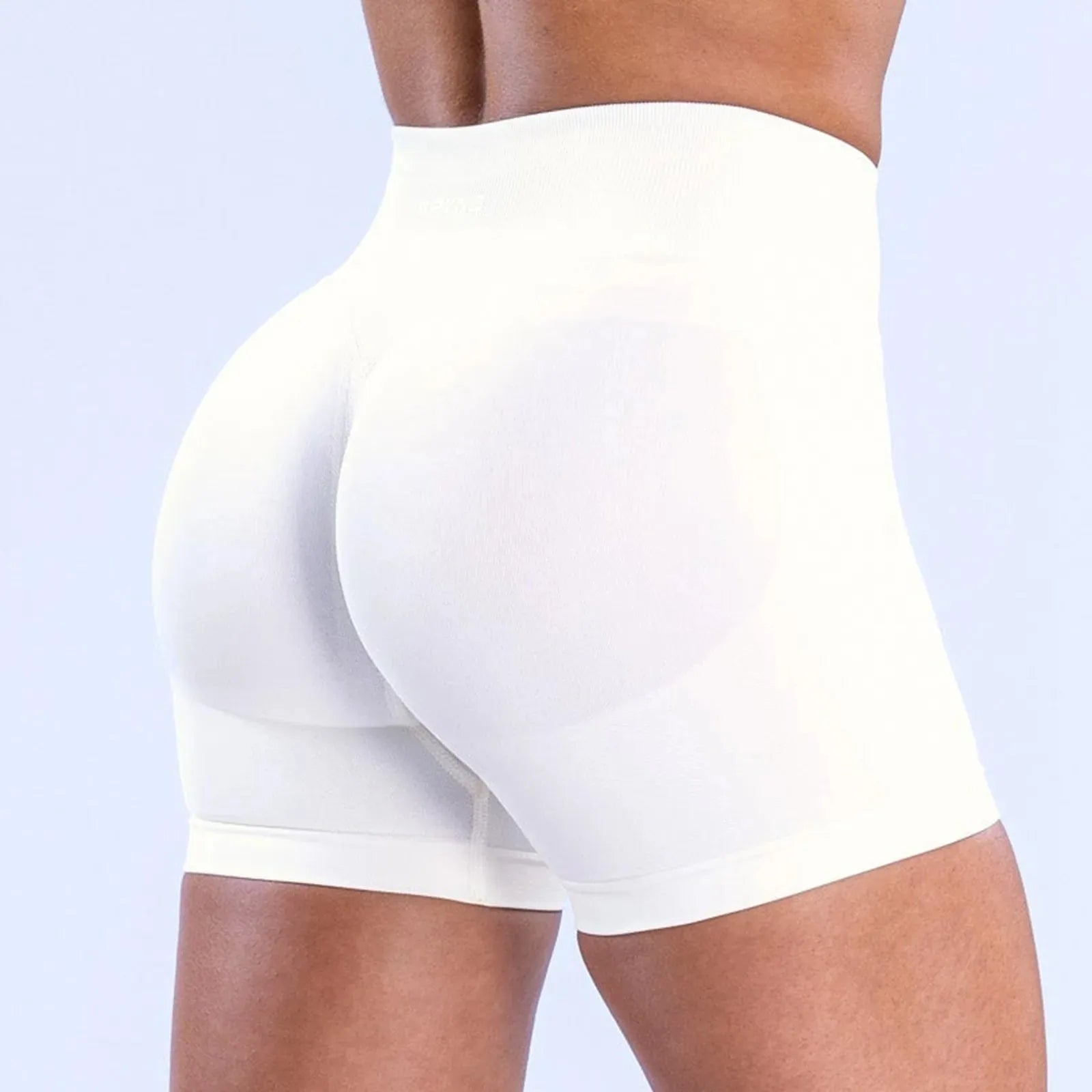 Women's high-waisted gym sports tight running shorts in white, perfect for workouts and yoga.
