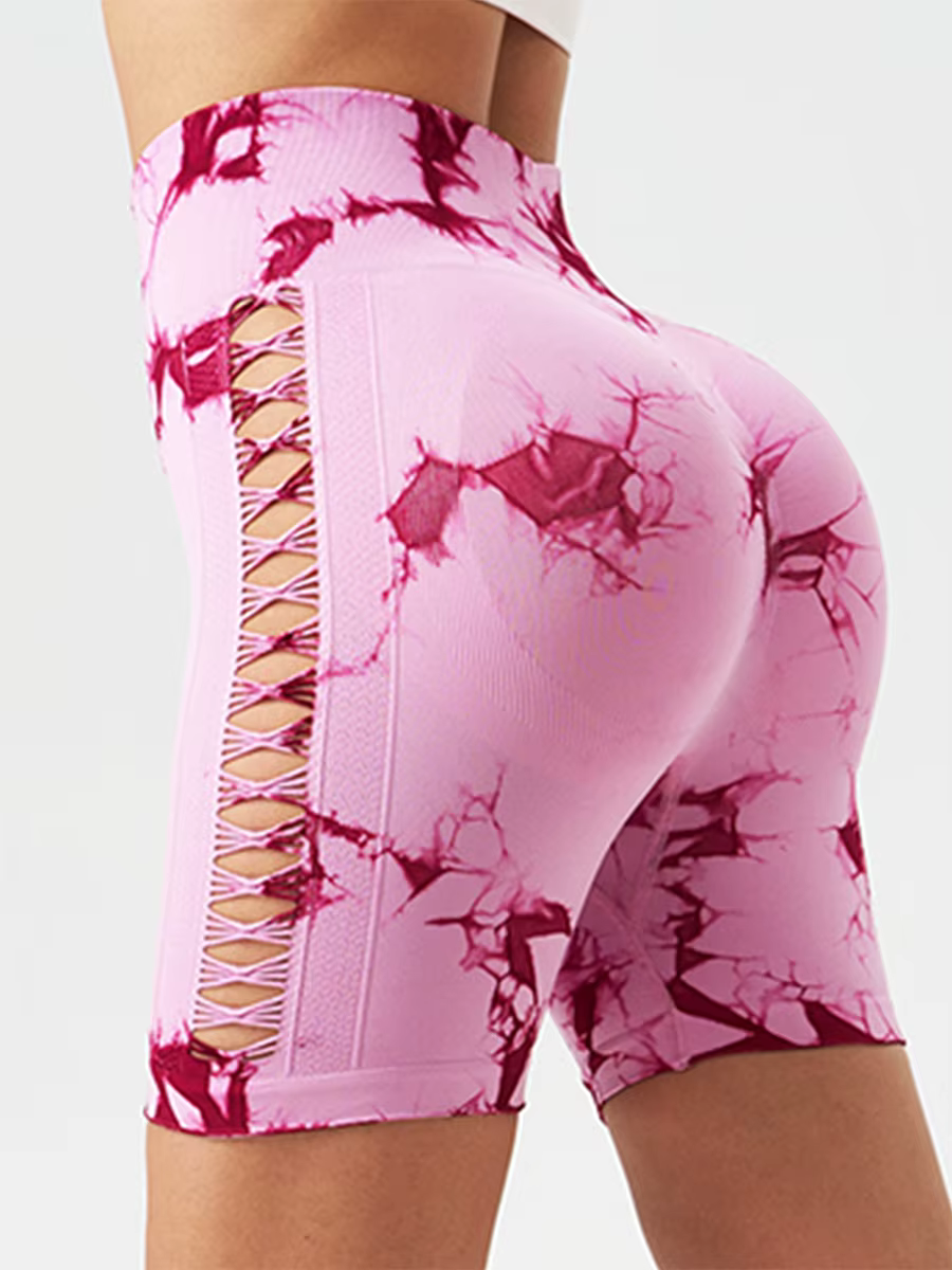 Women’s high waist yoga shorts in pink with a trendy lace-up design and moisture-wicking fabric for activewear comfort.