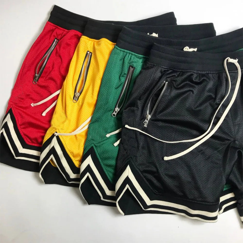 Colorful men's mesh basketball shorts in red, yellow, green, and black with side pockets and sporty design.