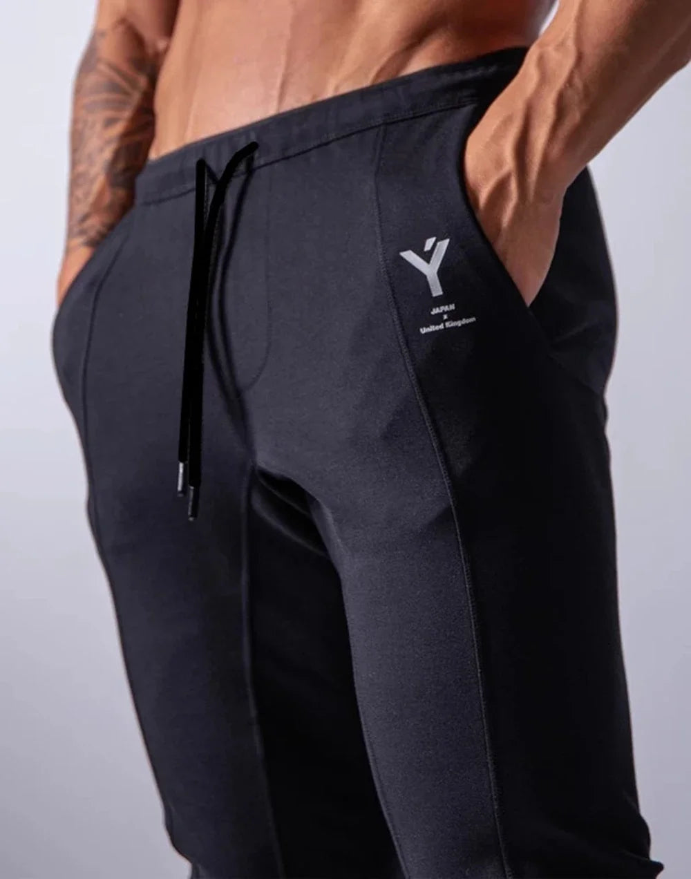 Men's performance training pants in black, showcasing comfort and versatility for workouts.