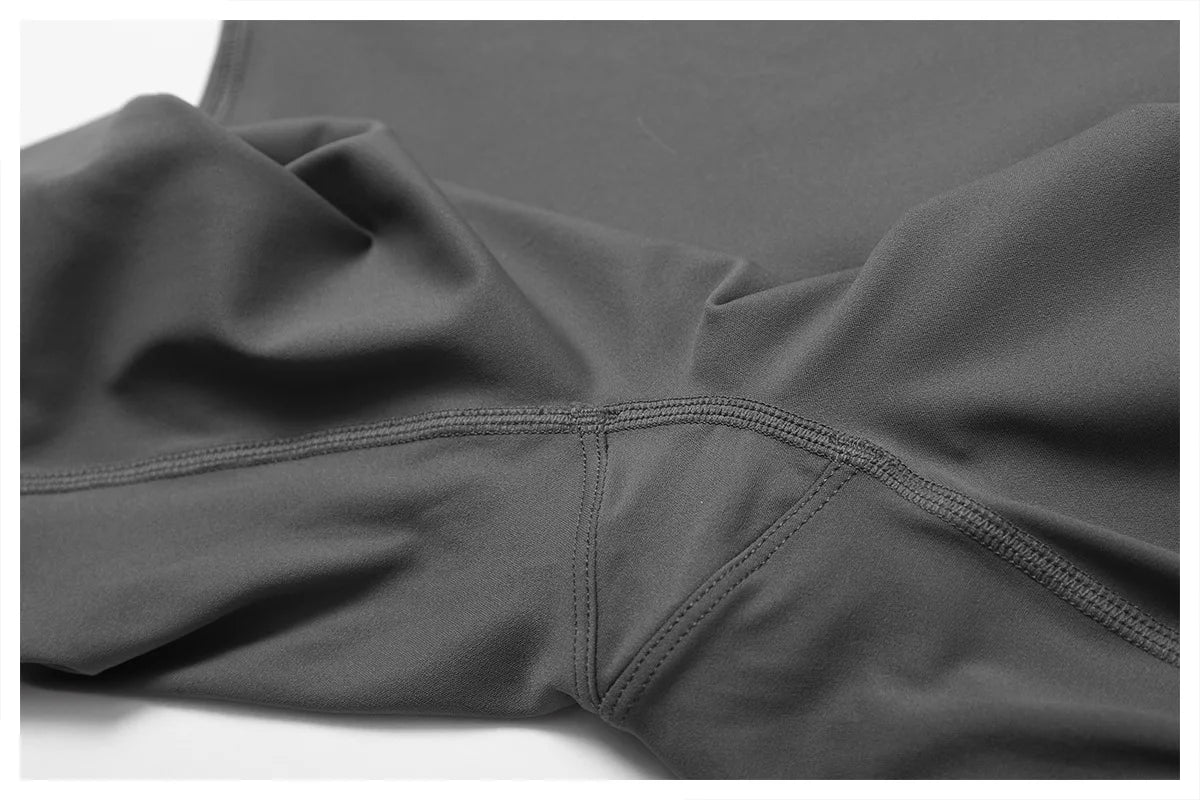 Close-up of high-waist scrunch butt yoga leggings fabric showcasing sleek stitching and soft texture.