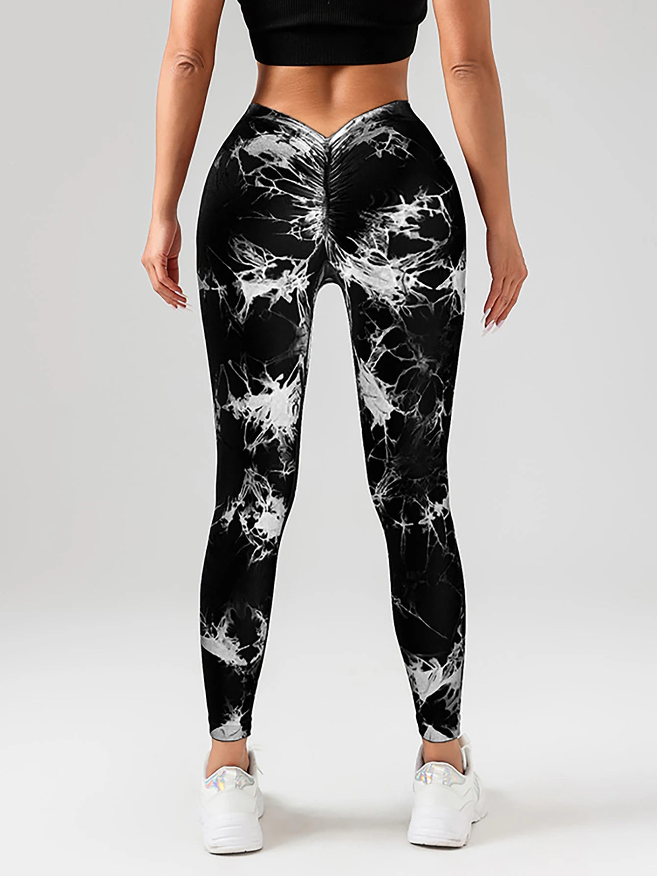 Back view of high-waisted tie-dye scrunch butt yoga leggings designed for curve enhancement and comfort.