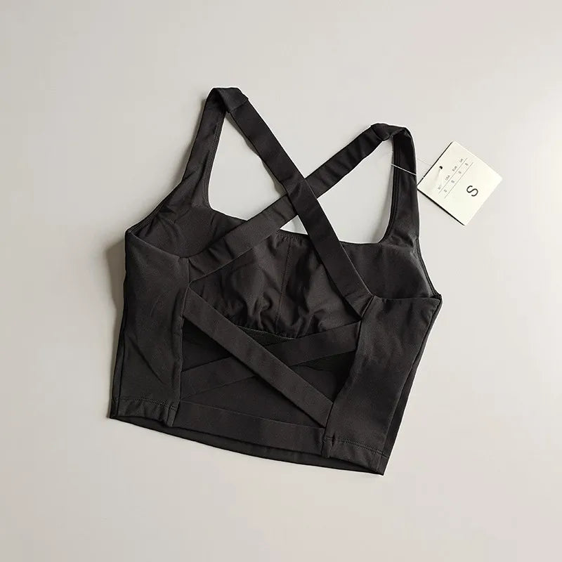 Seamless push-up sports bra for women in sleek black with crisscross straps and soft fabric for comfort and support.