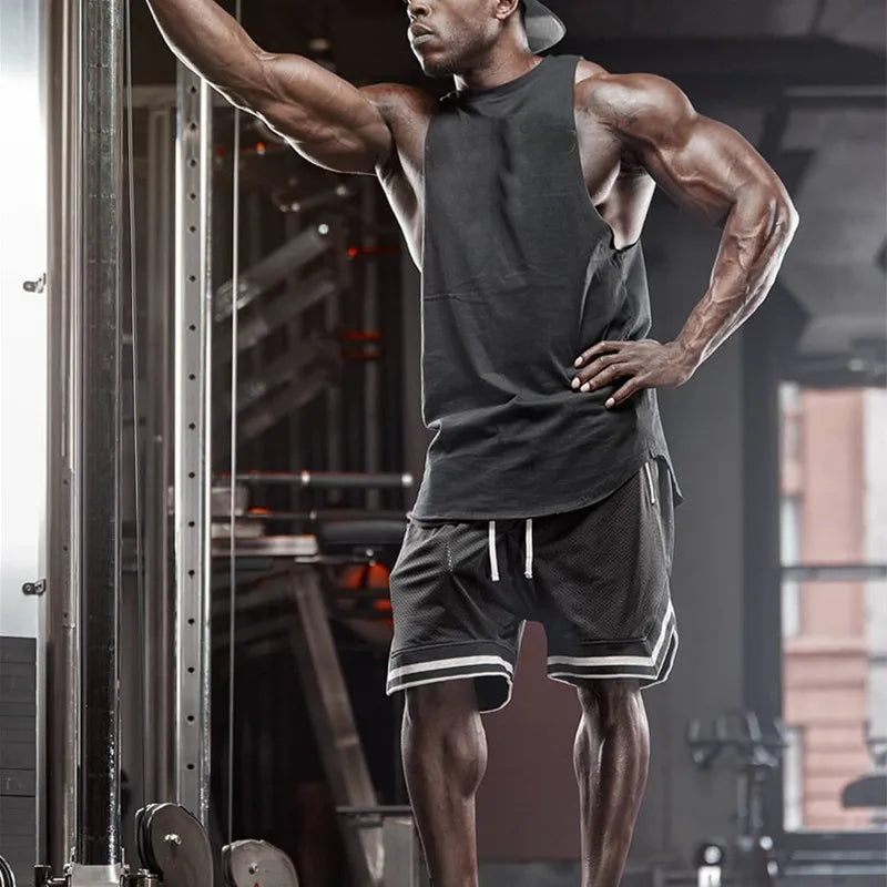 Athletic man wearing men's mesh basketball shorts and tank top, training in a gym setting.