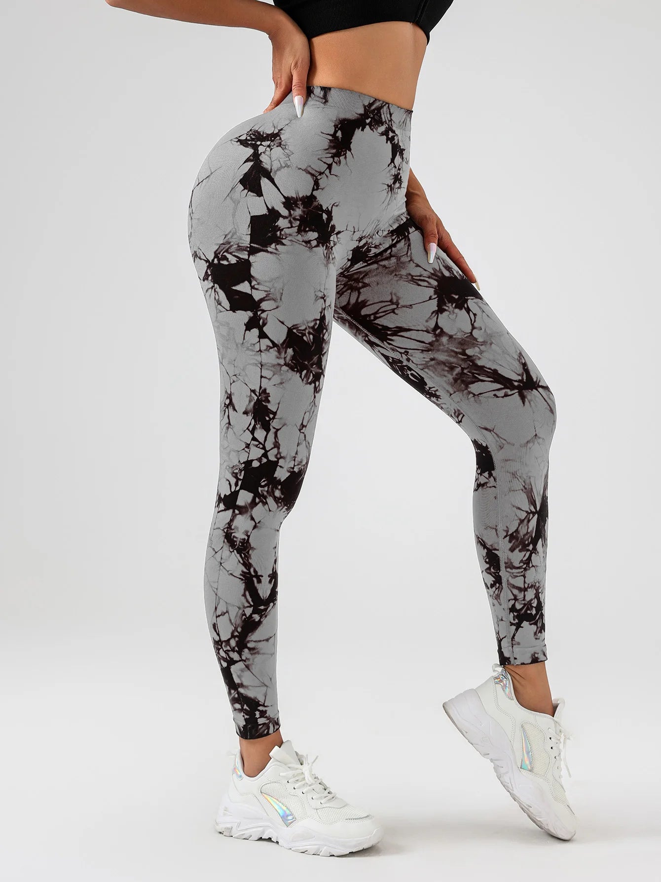 High-waisted tie-dye scrunch butt yoga leggings in gray and black, perfect for gym workouts and sculpting your curves.