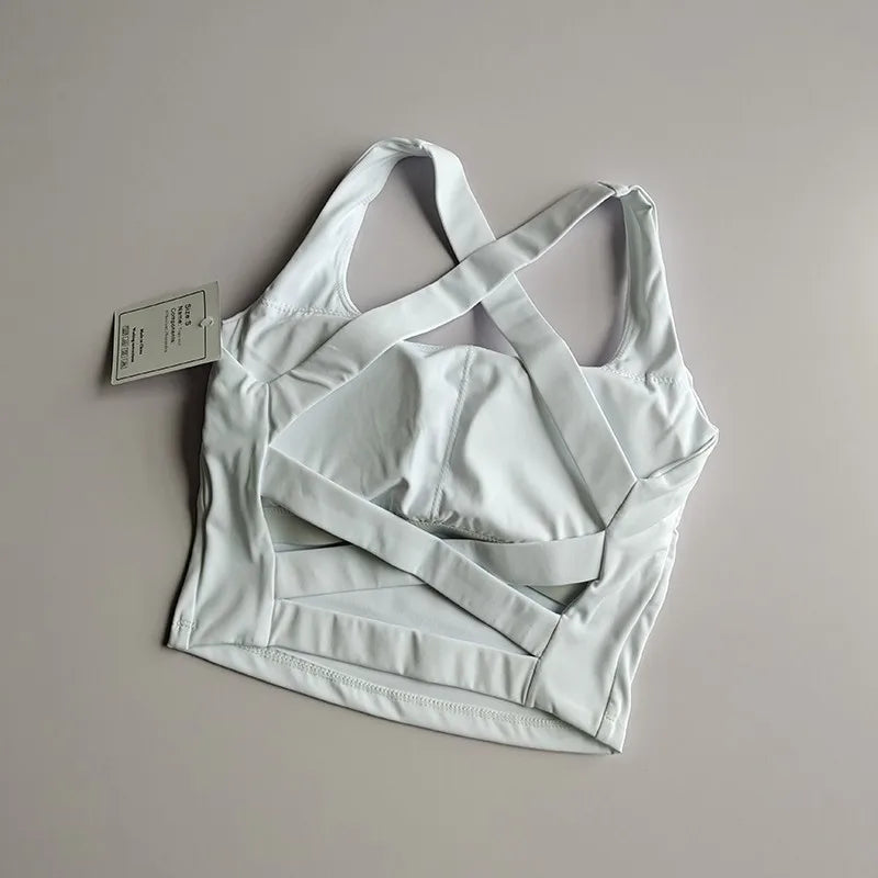 Seamless white push-up sports bra for women, featuring a crisscross back design and soft, breathable fabric.