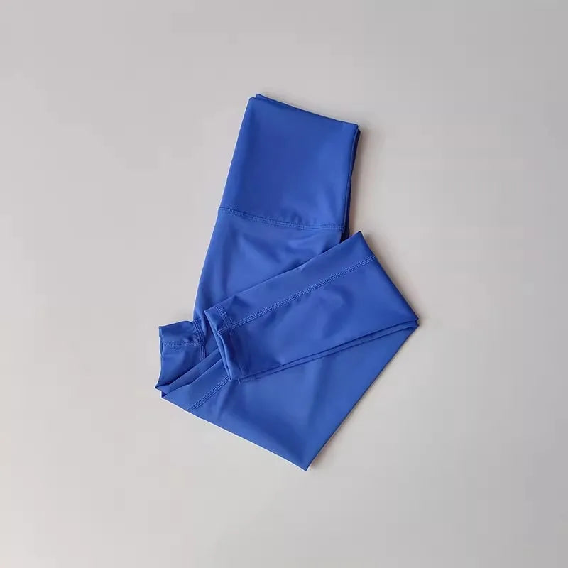 Blue high-waisted leggings from women's yoga set, made of breathable nylon-spandex blend for comfort and mobility.