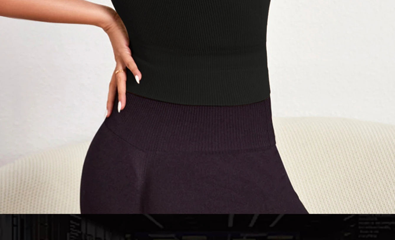 Seamless ribbed yoga vest for women in black, designed for comfort and breathability during workouts.