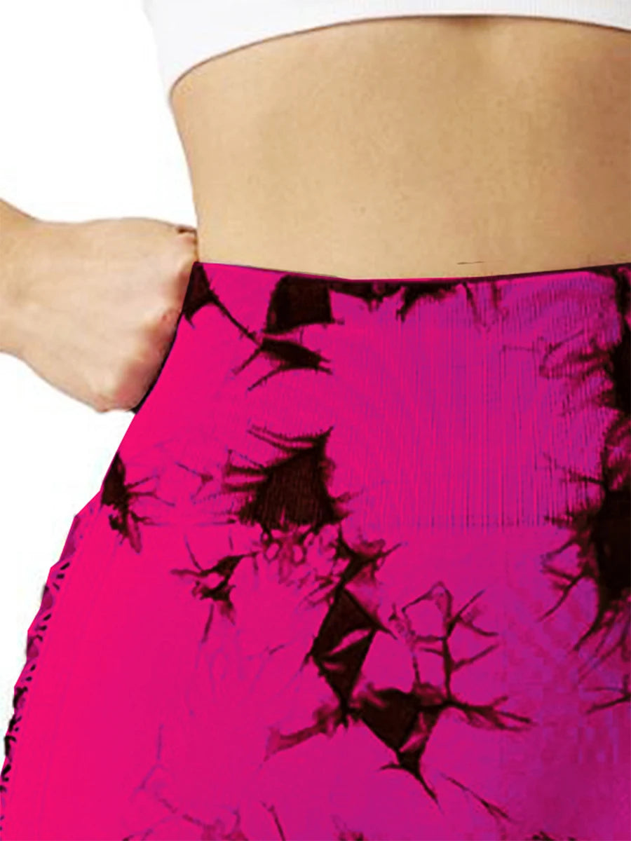 Close-up of high waist yoga shorts in vibrant pink, showcasing a comfortable fit and stylish design for activewear.