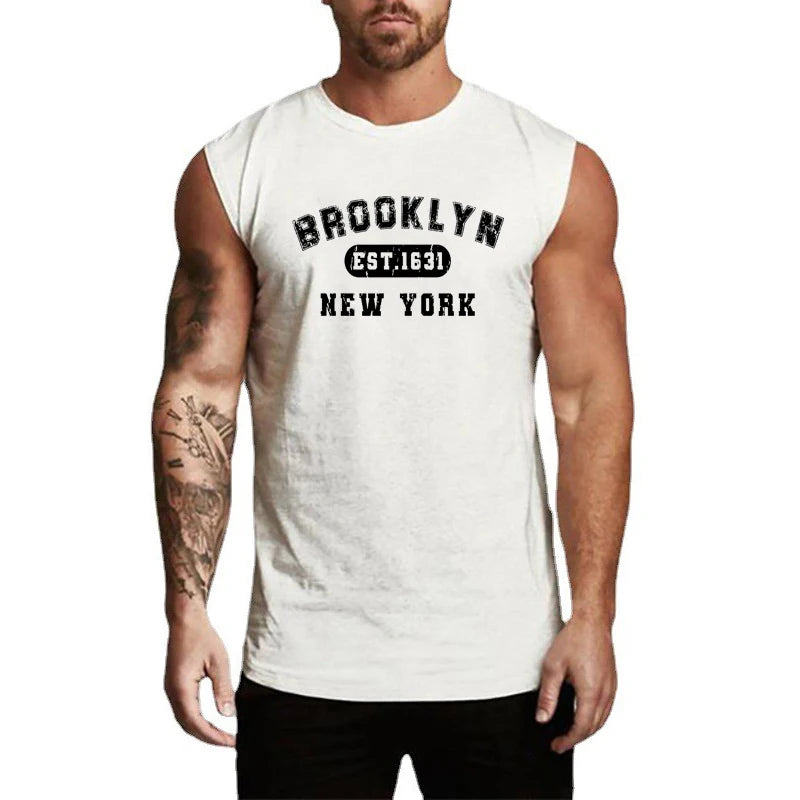 Man wearing a sleeveless cotton tank top with 'Brooklyn EST. 1631 New York' printed design.