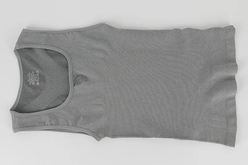Men's compression tank top in grey, designed for slimming and body shaping with dry-fit material.