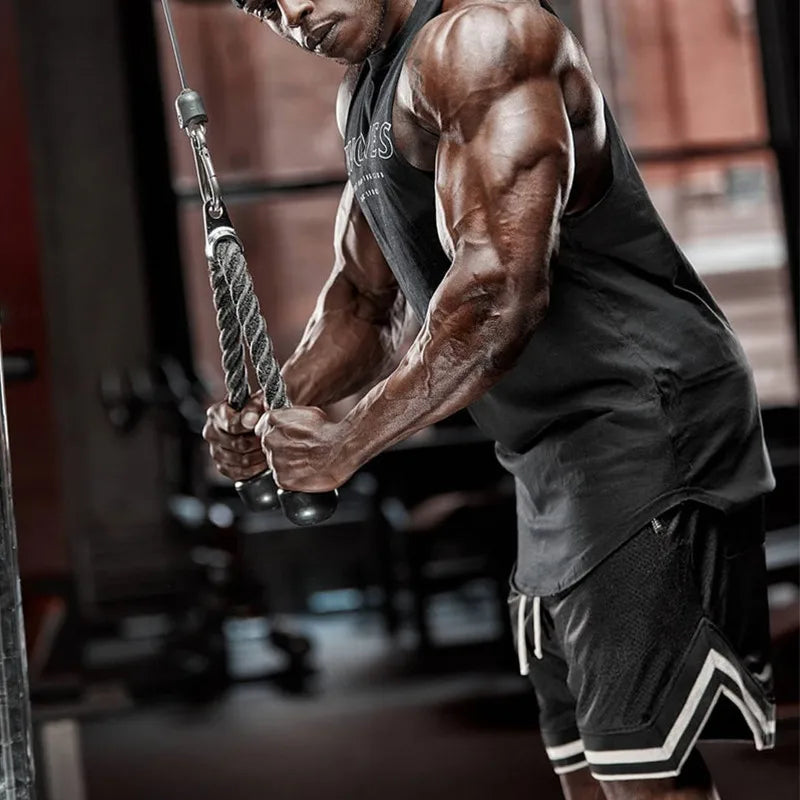 Athlete in Men's Mesh Basketball Shorts performing cable workout in the gym, showcasing strength and style.