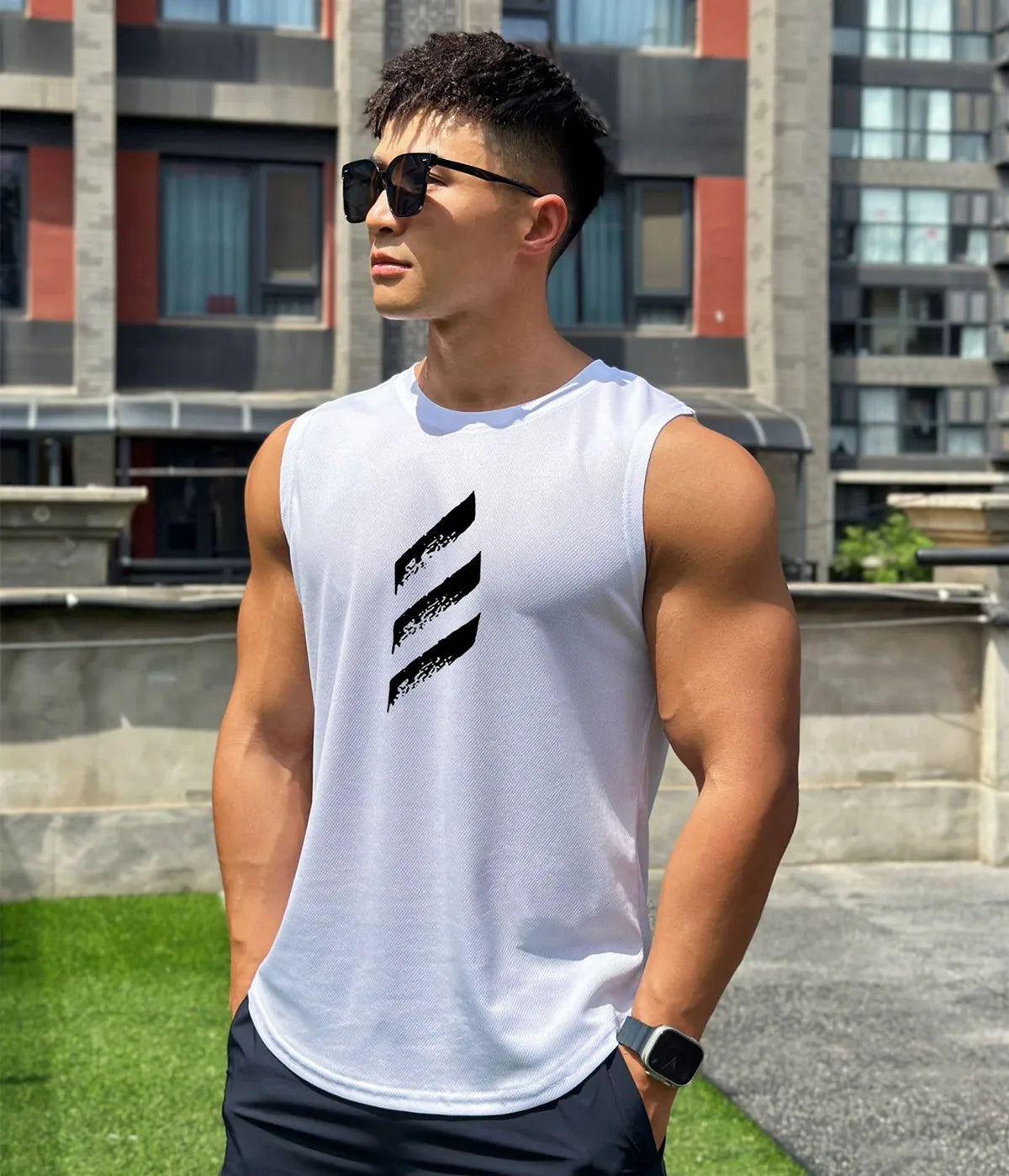 Men's sleeveless quick-dry gym tank top in white, showcasing muscle definition and sporty style during summer workouts.