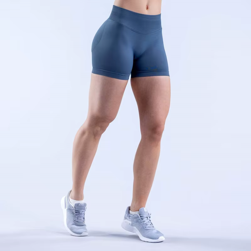 Model wearing Gym Impact Running Shorts in blue, showcasing performance fabric and stylish design for workouts.