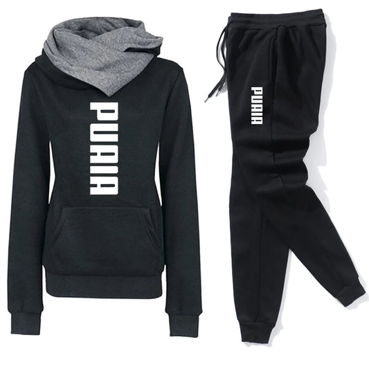 Women's black tracksuit set featuring hoodie and sweatpants with PUAIA branding, perfect for athleisure wear.