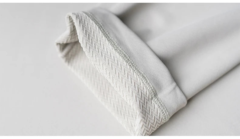 Close-up of the cuff of a Men’s Speed-Dry Long Sleeve Fitness Top, showcasing the stretchy and breathable fabric.