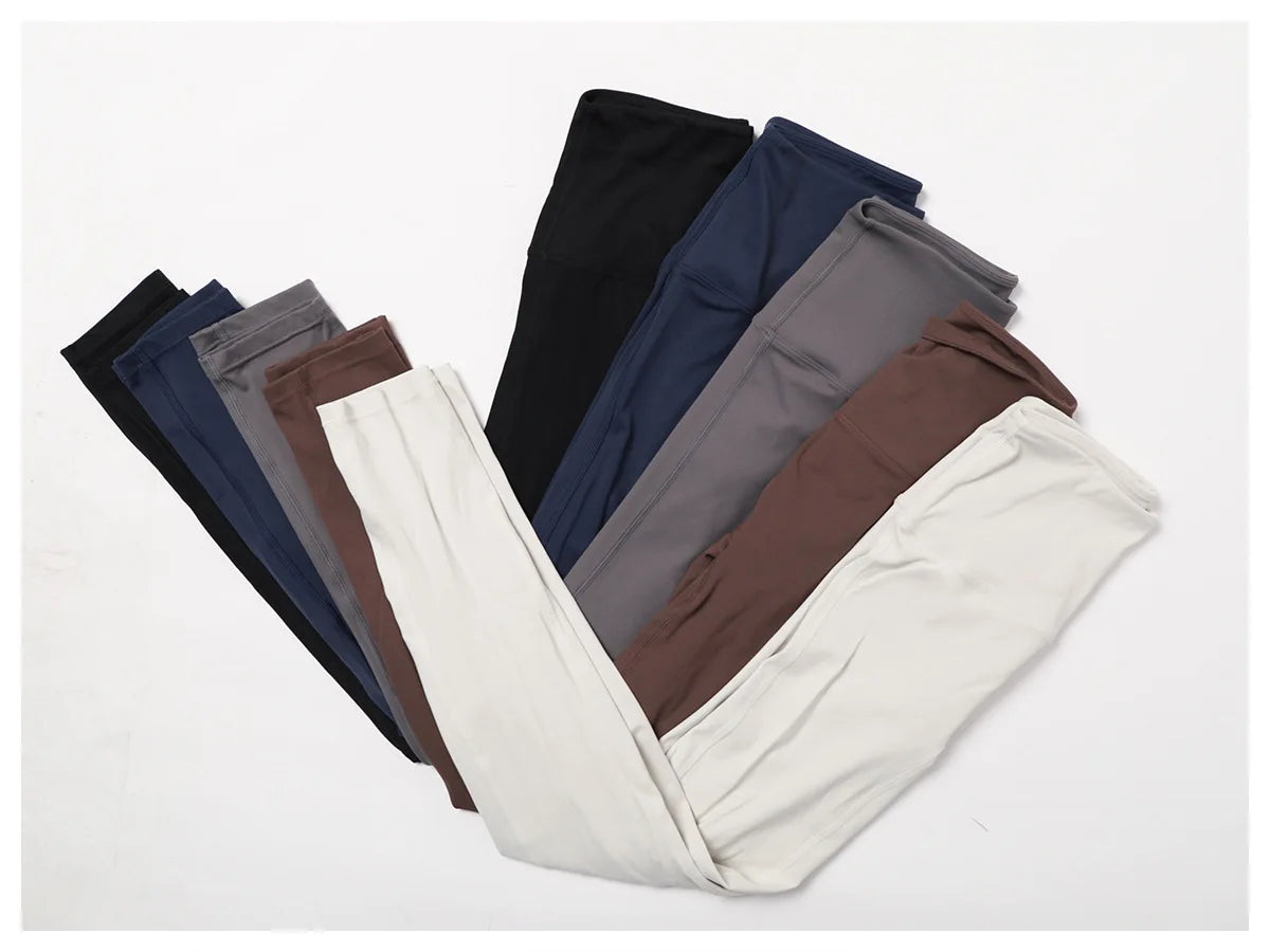 Collection of high-waist yoga leggings in various colors, showcasing style and comfort for active women.