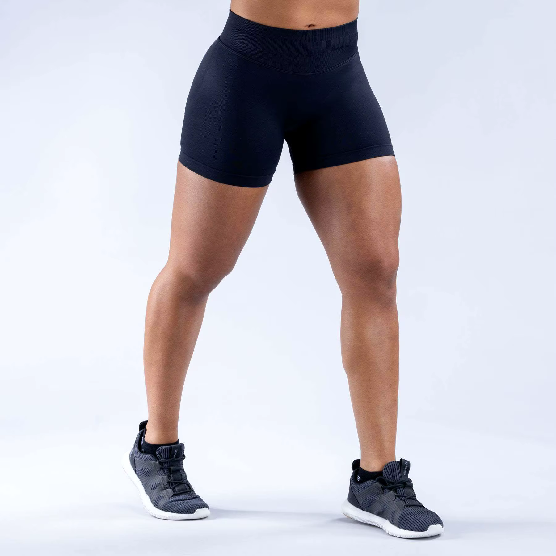 Model showcasing Gym Impact Running Shorts, designed for comfort and performance during workouts.