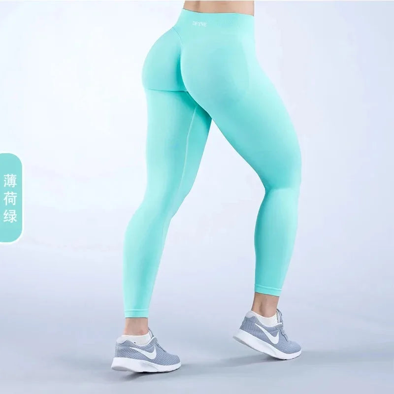 Seamless Woman Impact Yoga Long Pants in mint green, showcasing four-way stretch and high-performance fabric.