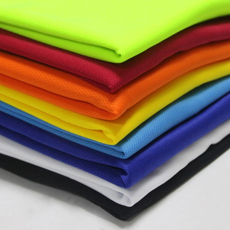 Colorful layers of quick-dry polyester fabric for sportswear, ideal for running and gym activities.