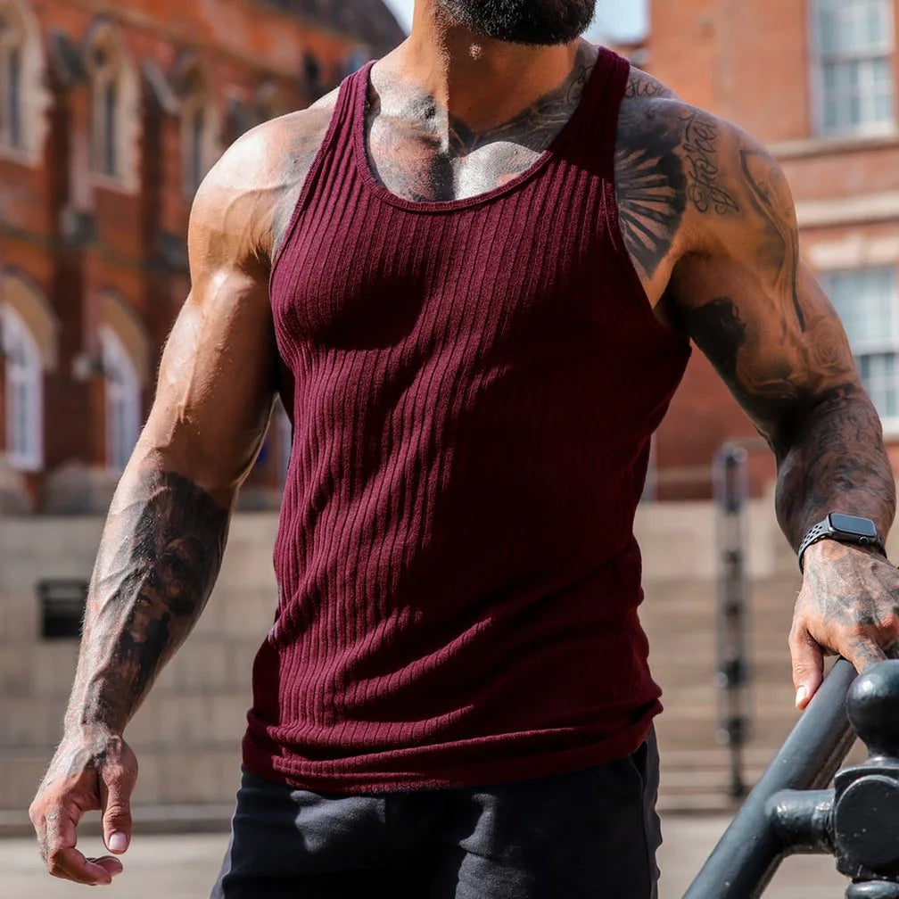 Men's sleeveless maroon tank top, perfect for summer fitness and casual wear featuring ribbed texture.